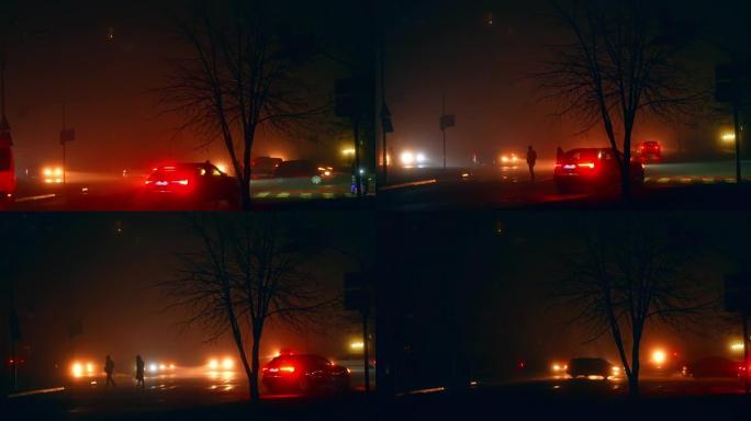 行人在汽车前灯的灯光下在人行横道过马路。冬季晚上停电的城市。停电。