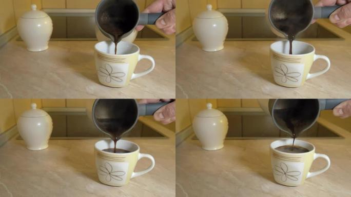一个人将刚煮好的咖啡从电锅倒入站在厨房柜台上的杯子中，近距离拍摄