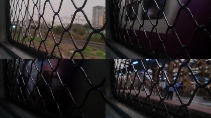 带金属网栏杆的火车车窗特写。