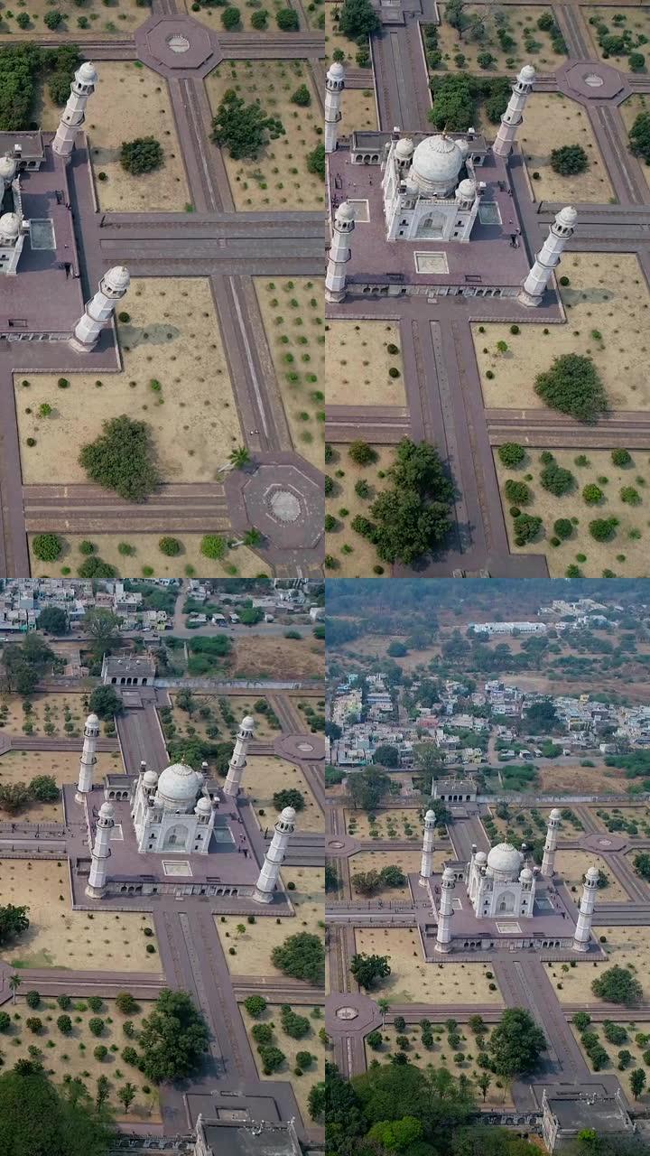 大理石陵墓的空中拍摄的垂直视频，带有巨大的花园，背景为山丘
