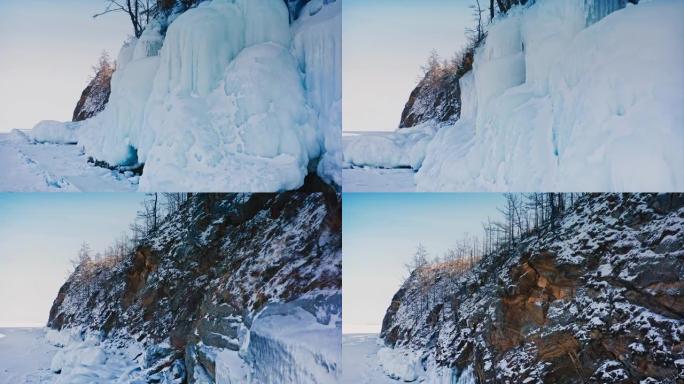 贝加尔湖，岩石上的大冰，挂冰柱。一种罕见的自然现象。俄罗斯西伯利亚贝加尔湖。空中无人机射击4k