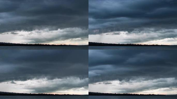 黑暗戏剧性的暴风雨天空的时间流逝，湖上快速移动的乌云