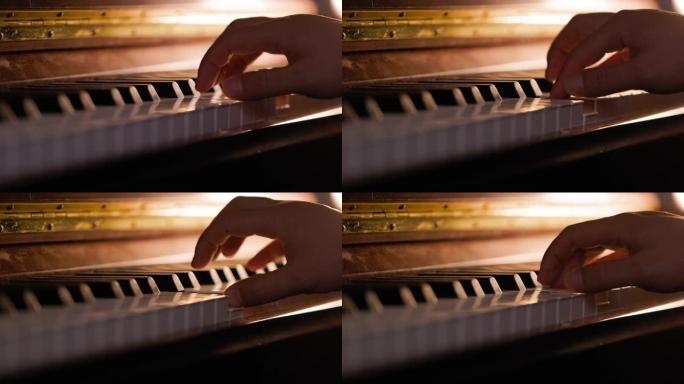 一个男人的手练习钢琴的特写