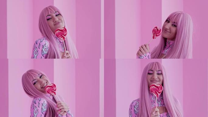 时尚粉色发型美女模特拿着彩色棒棒糖