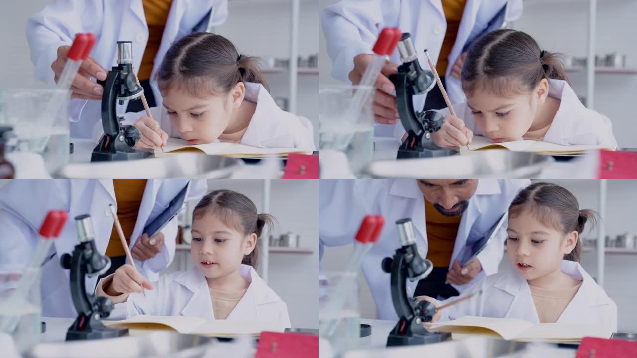 4K，女学生，科学室，站着拿着试管的手，前小显微镜放置，学生正在做实验笔记，听老师他们如何写下正确的