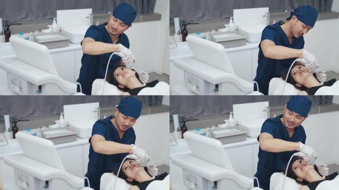 亚洲中国男性美学家在患者面部使用超声SMAS瘦脸