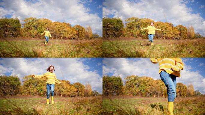 一个女孩带着秋天的草沿着田野奔跑。人与自然是一体的。健康理念。保健，真实性，平衡感和镇定感。
