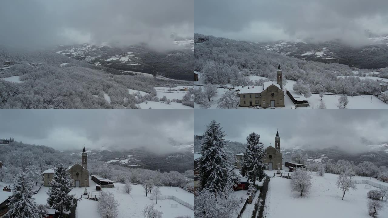 意大利皮亚琴察韦尔纳斯卡城堡上空的冬季暴风雪，被积雪覆盖，当地教区的无人机航拍视频