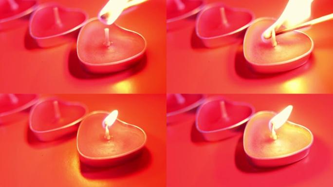 红色燃烧的蜡烛呈心形，火焰燃烧。红色背景上的火舌。情人节，激情，爱情，感情，浪漫的心情概念。2月14