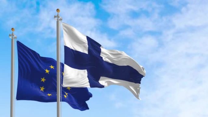 在一个晴朗的日子里，芬兰国旗和欧盟国旗一起飘扬。