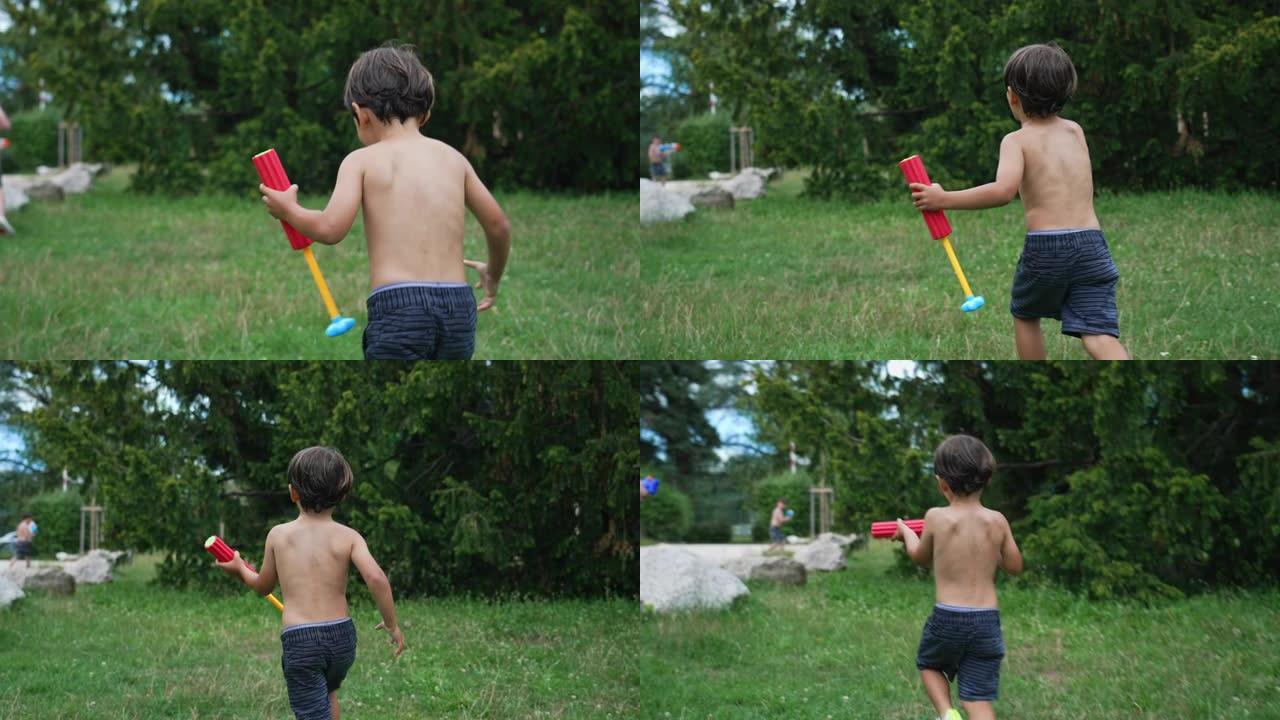 夏天，孩子们在花园里跑外面，用玩具泡沫枪和孩子们玩水仗