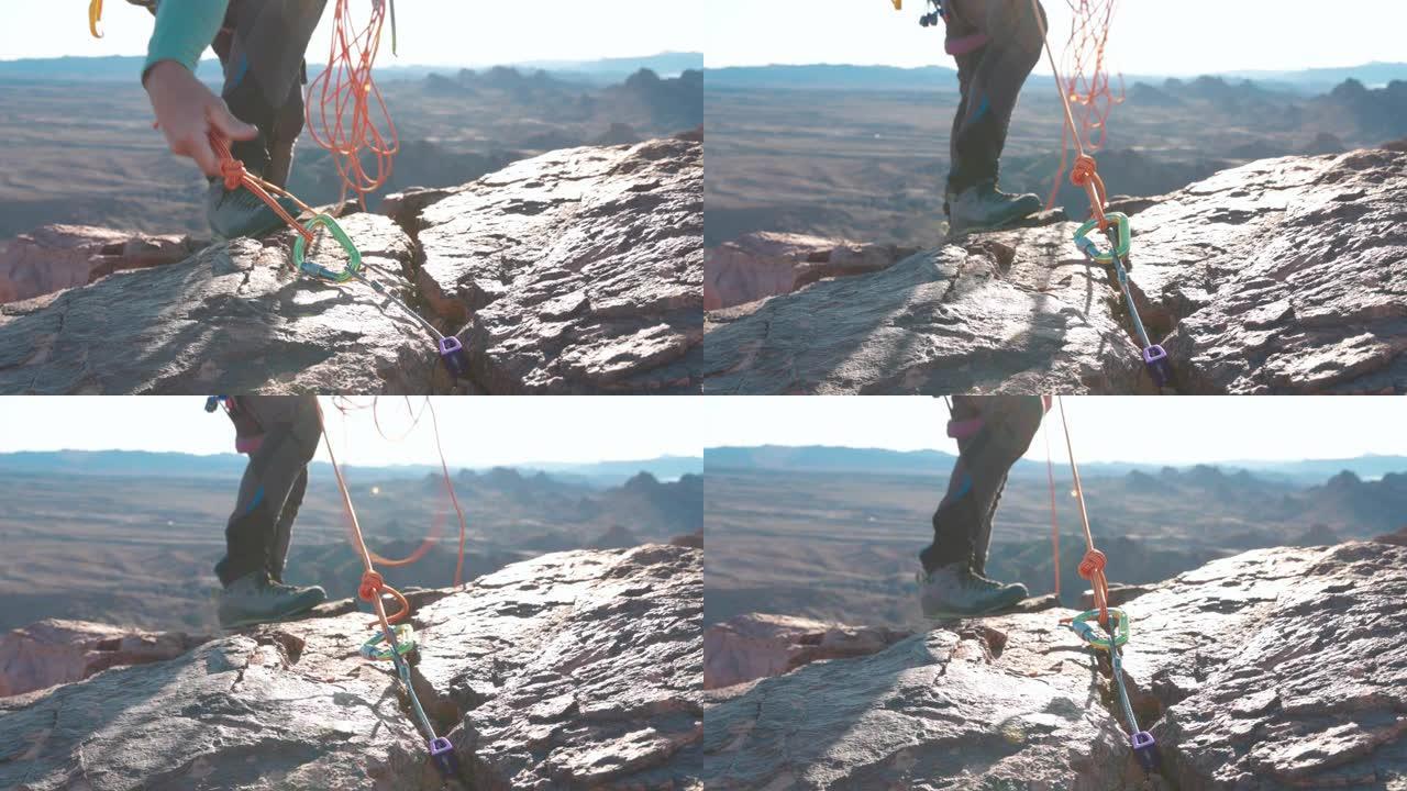 攀岩者准备从山脊上下降的锚