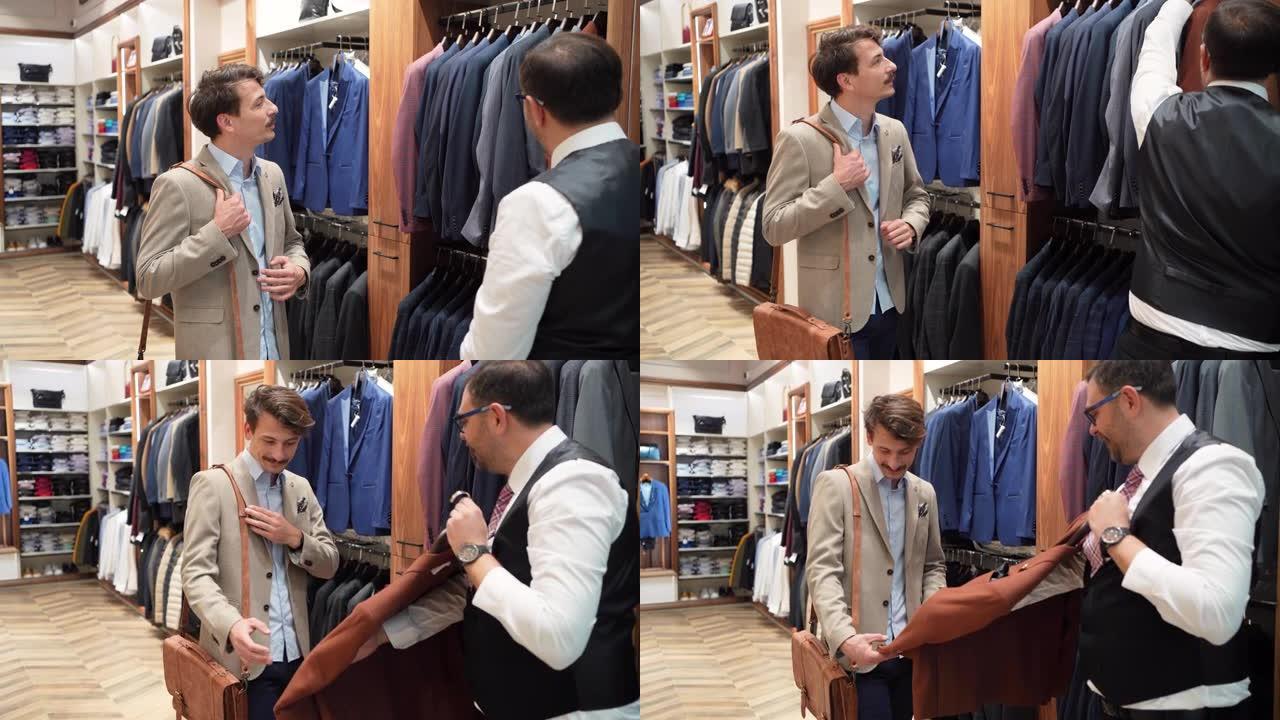 在奢侈品精品店，推销员向男性顾客展示他想尝试的西装