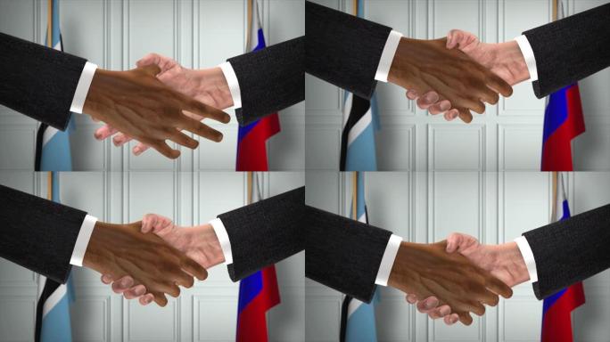 博茨瓦纳与俄罗斯达成协议握手，政治例证。正式会议或合作，商务见面。商人和政客握手