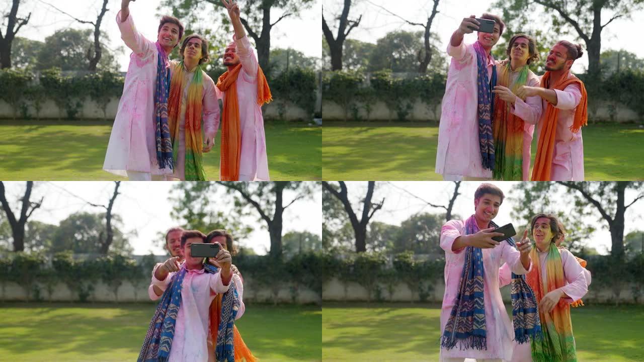 印度男子在传统服装的洒红节上点击图片
