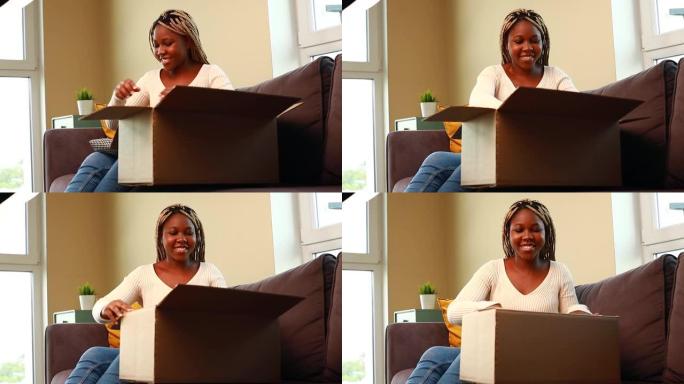 一名非裔美国妇女打开箱子里的东西