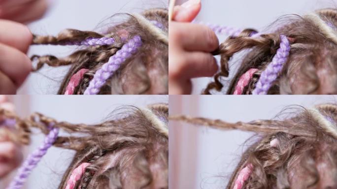 美发师解开箱形辫子，头发从根部到尖端变得卷曲。