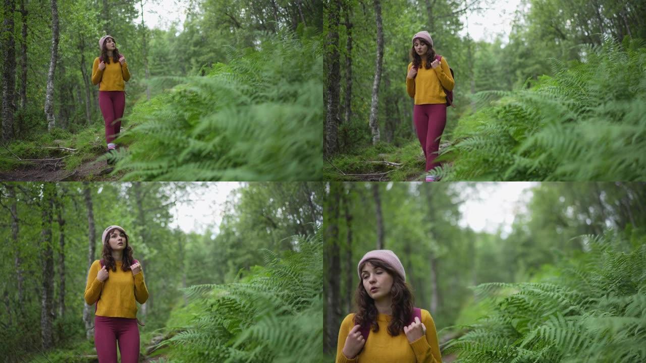 妇女在挪威的森林中徒步旅行