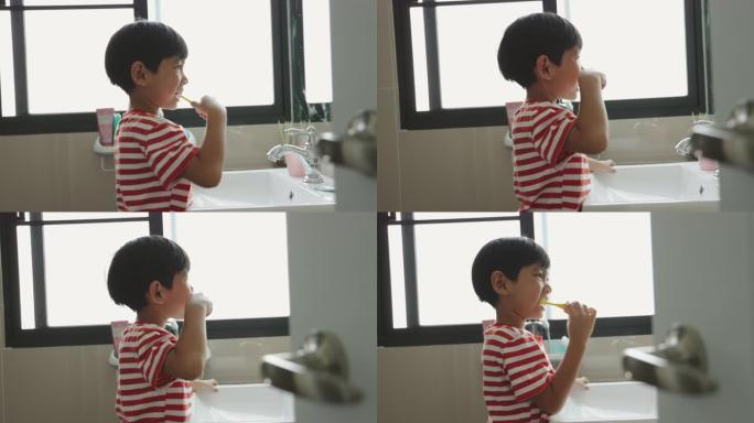 亚洲男孩刷牙防止蛀牙。儿童进食后注意口腔卫生。