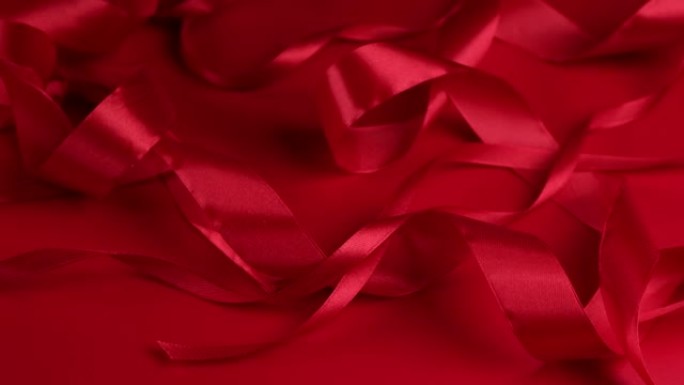 红色旋转背景，红色缎带。庆祝情人节或其他节日的概念