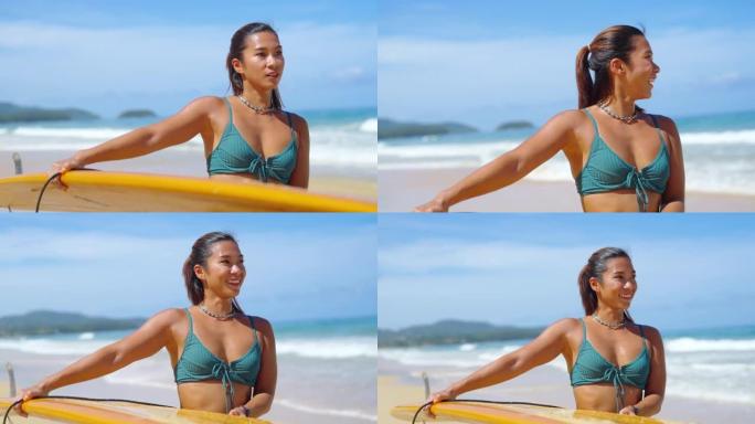 4k亚洲女子拿着冲浪板在夏天阳光明媚的日子里走向大海。