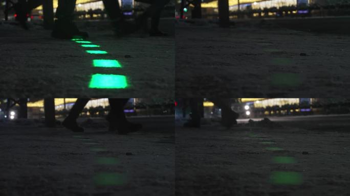 新的现代交通灯在人行道上发光。