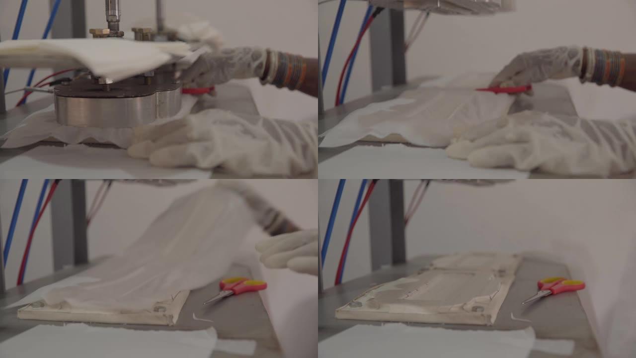 在小工厂用半自动机器制作卫生巾