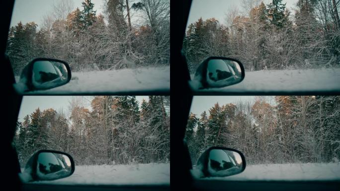 森林后视镜POV的冬季雪路