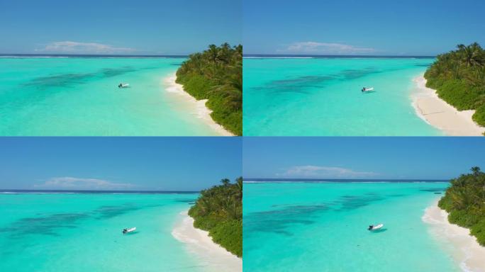 马尔代夫Thoddoo岛天堂海滩上的渔夫航拍照片。
