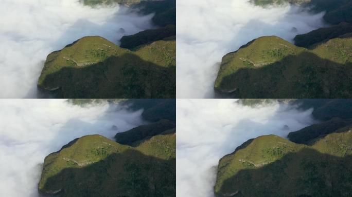 用无人驾驶飞机在马德拉岛的高山上和被称为皮卡·达·卡纳的视点上拍摄的真棒。葡萄牙山谷的大雾海。