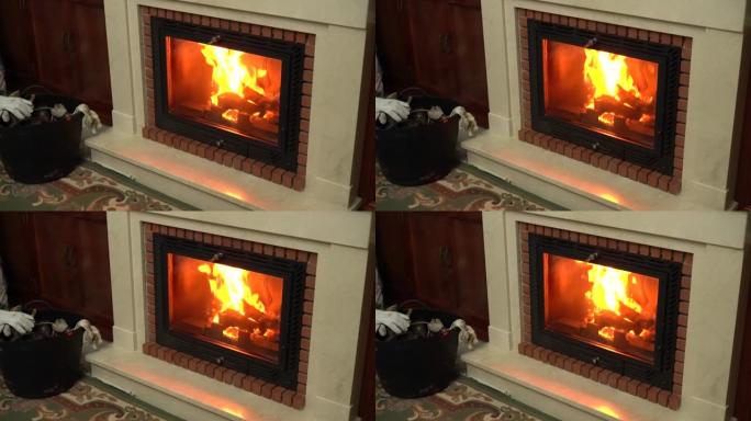 寒冷的日子里，温暖舒适的木质壁炉，配有经典装饰。冬季和家庭概念，壁炉的静态背景。