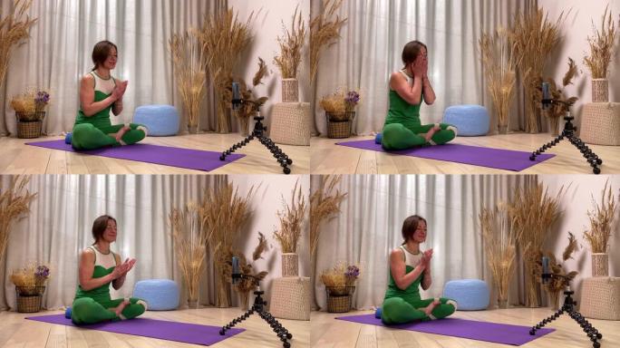 瑜伽老师健身教练在运动服做气功面部按摩