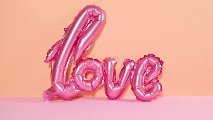 爱情气球来到柔和的橙色粉色主题。停止运动