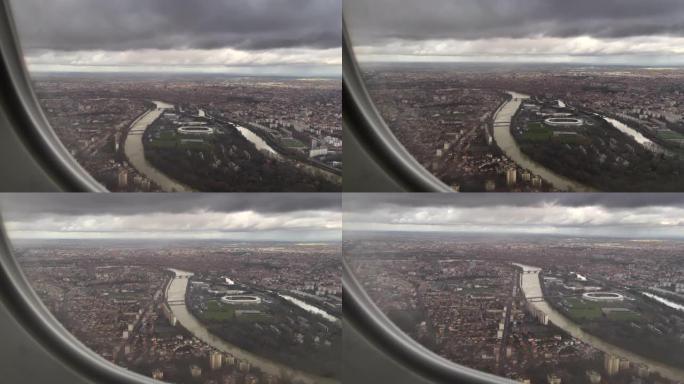 飞行降落在城市。乘客透视飞机窗。从上方看城市景观