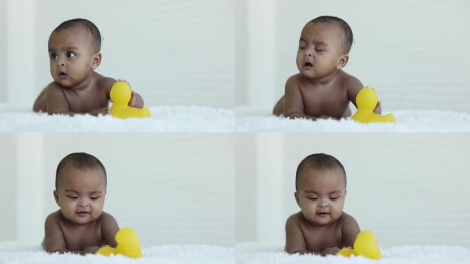 脱衣服的非洲裔美国婴儿在家里的房间里有面部表情。婴儿生长。儿童身体发育的运动。关爱儿童健康健康。幼儿