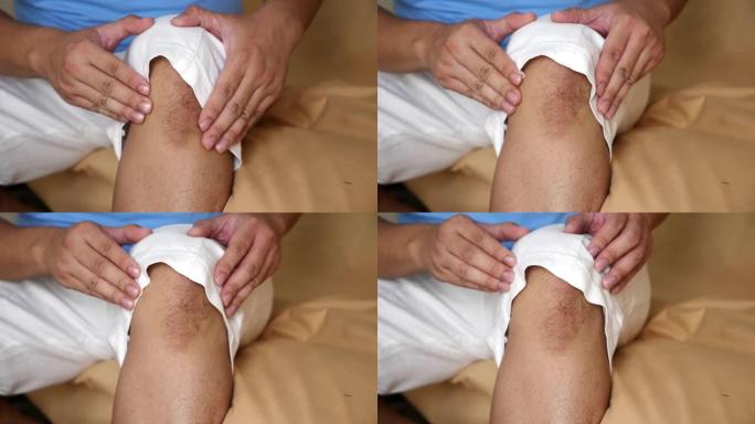 男子揉膝盖，膝盖疼痛肌肉受伤