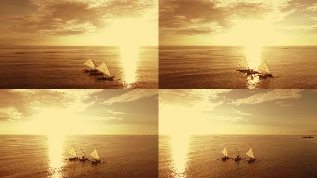 印度尼西亚巴厘岛沙努尔海滩帆船，空中拍摄，海滩金色天空
