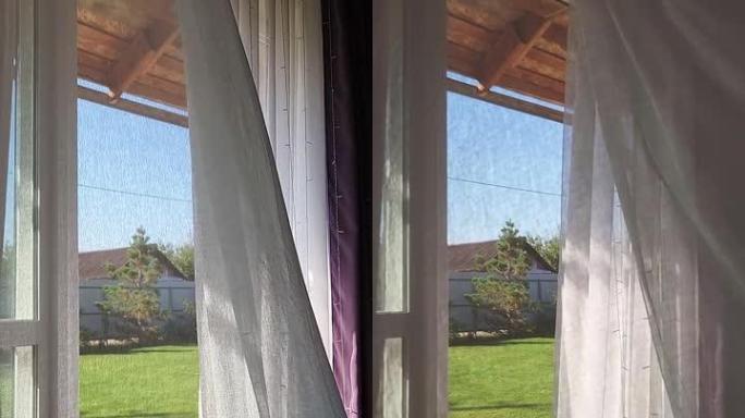 房间内部有敞开的窗户，可以俯瞰后院和草坪。透明薄纱，阴影背景上有早晨的阳光。垂直视频。