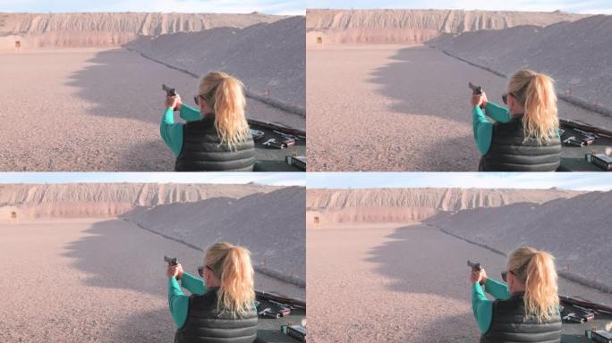 成熟的女人在既定的射击范围内开枪射击