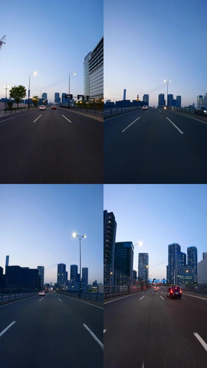 黄昏时在城市高速公路上行驶。在高速公路上驾驶汽车/高速