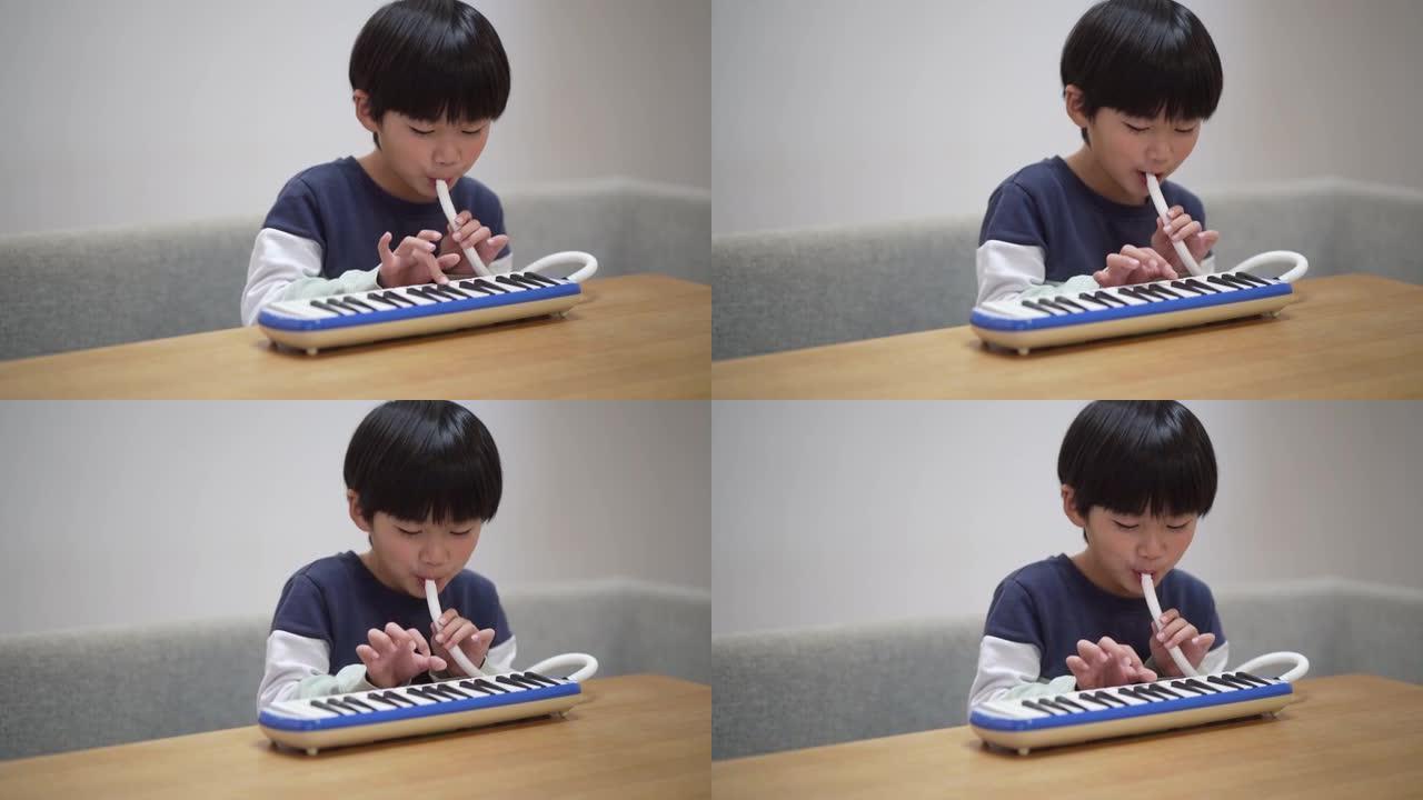 练习键盘口琴的男孩