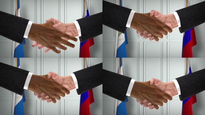 尼加拉瓜与俄罗斯达成协议握手，政治说明。正式会议或合作，商务见面。商人和政客握手