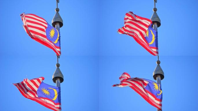 马来西亚的大国旗在风中飘扬，在阳光下飘扬。荣耀条纹。Jalur Gemilang。缓慢的运动。版本2
