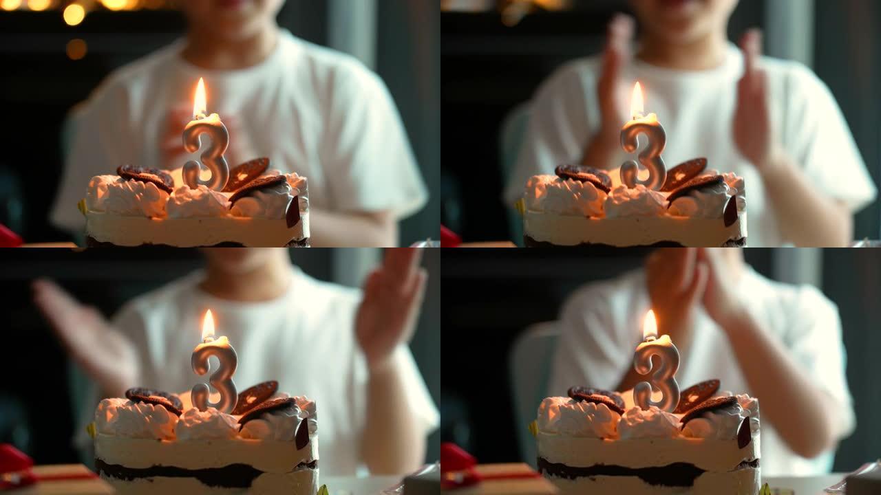亚洲孩子带着他的生日蛋糕和礼物。庆祝和欢乐的概念