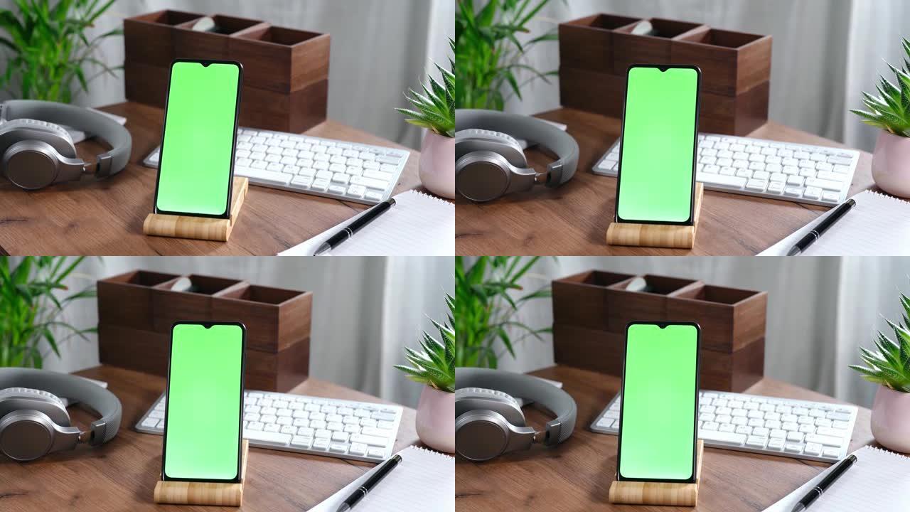 智能手机放在办公桌上的支架上