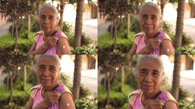 一名接种疫苗的老年妇女的肖像，展示了她在户外打着绷带的手臂
