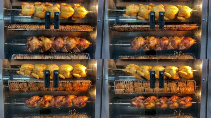 在餐厅或街头市场的电烤炉上旋转美味的烤鸡和火鸡。酥脆、油炸、不健康的快餐。