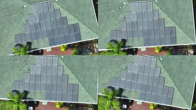 美国郊区农村地区的普通住宅，屋顶覆盖太阳能电池板，用于生产清洁生态电力。投资自主节能住宅的概念