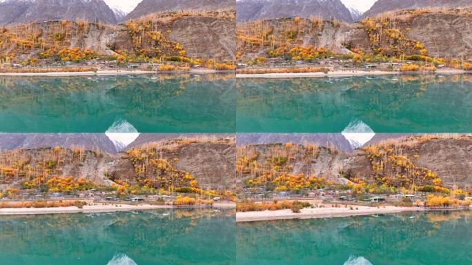 哈尔提湖的空中无人机日出场景位于巴基斯坦北部秋季古皮斯-亚辛区或吉尔吉特-巴尔蒂斯坦的哈尔提村，海拔