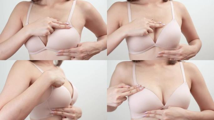 乳腺癌，世界癌症日。年轻的亚洲妇女检查，触诊乳房肿块或癌症。